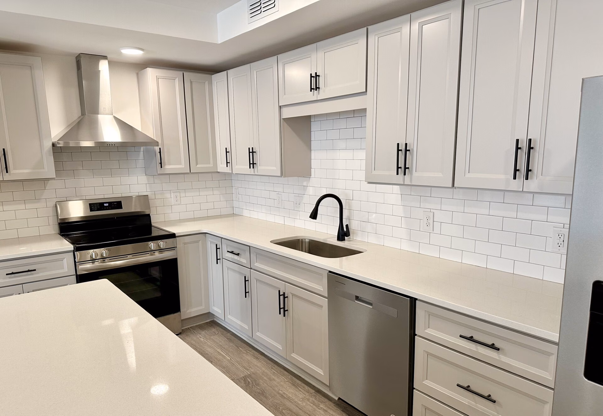 Kitchen with quartz counters and stainless appliances
